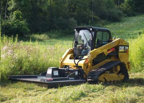 brush cutting uneven ground with a skid steeer|skid steer brush cutting.